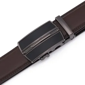 Detail of dark brown lychee grain leather belt with gunmetal automatic slide buckle