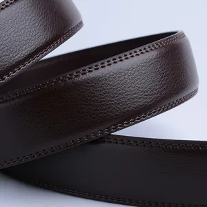 Macro shot of dark brown leather belt featuring lychee texture and double stitching