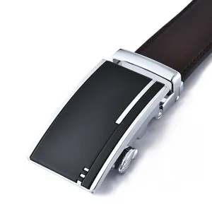 Detail of silver alloy buckle and dark brown lychee grain leather belt for men