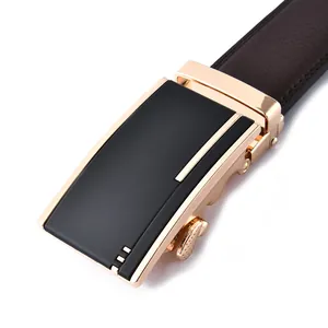 Macro detail of men's leather belt featuring a matte black and rose gold automatic buckle