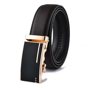 Macro detail of men's leather belt featuring a refined golden buckle and stitching