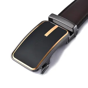 Close-up of brown leather belt with automatic buckle featuring gold striped metal finish