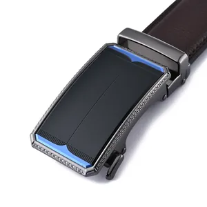 Close-up of a brown leather belt with a gunmetal automatic buckle and blue accents