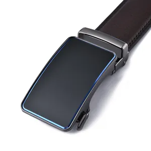 Detail of grey metal buckle with blue stripe and brown litchi pattern leather belt