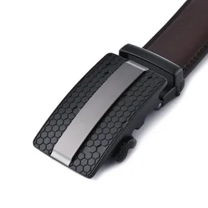 Detail of men's leather belt with honeycomb texture black buckle and matte metal insert