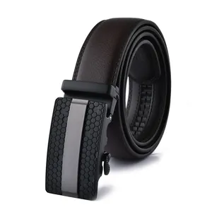 Detail of automatic black metal buckle with honeycomb pattern on leather belt