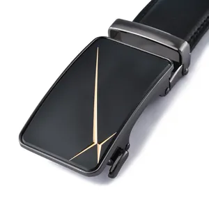 Detail of men's leather belt featuring a matte black automatic buckle with gold geometric lines
