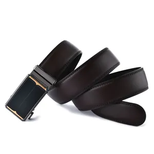 Macro detail of dark brown litchi grain leather belt with a grey metal automatic buckle
