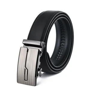Detail of men's leather belt with brushed gunmetal automatic buckle and texture