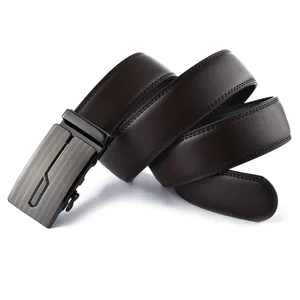Detail of dark brown leather belt with gray brushed metal automatic buckle on white background