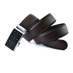Close-up of brown textured leather belt with silver automatic buckle and rivet details