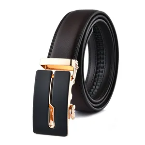 Detail of dark brown leather belt featuring a gold metal automatic buckle and lychee texture