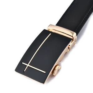 Close-up of black leather belt with a sleek gold-trimmed automatic metal buckle