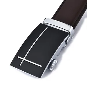 Detail of matte black automatic belt buckle with silver lines and leather stitching