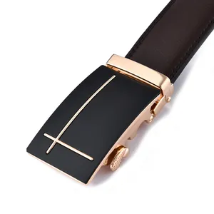 Close-up of golden automatic buckle with black panel on men's leather business belt