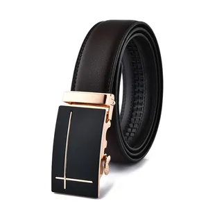 Detail view of brown leather belt with black and gold geometric automatic buckle