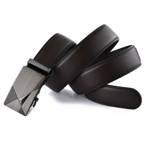 Macro detail of men's brown lychee leather belt with gray metal automatic buckle texture