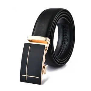 Macro detail of men's leather belt featuring black litchi texture and gold automatic buckle