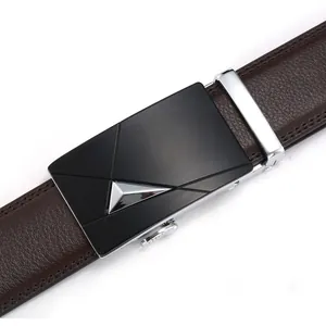 Close-up of brown leather belt with textured litchi pattern and matte black auto buckle