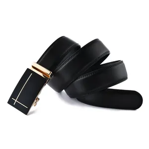 Detail of black leather business belt showing litchi texture and gold automatic buckle