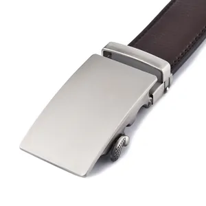 Close-up of men's automatic silver metal buckle with brown leather textured belt strap