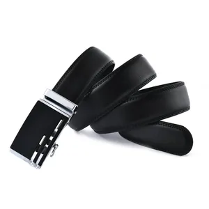 Macro shot of men's automatic buckle leather belt showing smooth texture and silver buckle