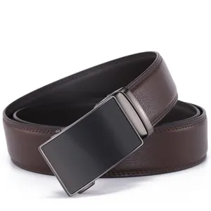 Close-up of brown litchi grain leather belt with gunmetal automatic buckle