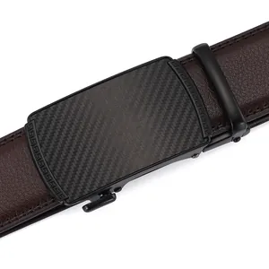 Detail of dark brown leather belt with black metal buckle and carbon fiber inlay