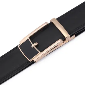 Macro shot of black leather belt with a luxury rose gold automatic buckle detail