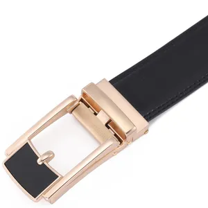 Detail of black leather belt with lychee texture and golden automatic buckle