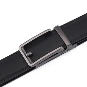 Detail of black leather belt with lychee texture and brushed gunmetal automatic buckle