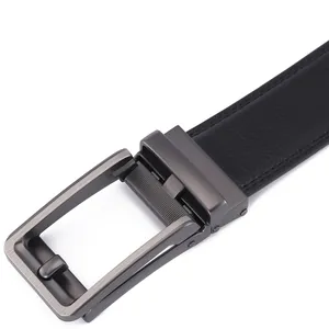 Close-up of black leather belt with gunmetal automatic buckle and lychee texture