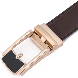 Macro shot of men's leather belt with gold and black automatic buckle and stitching