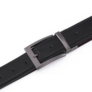 Detail of premium black leather belt with gunmetal brushed metal pin buckle and fine stitching
