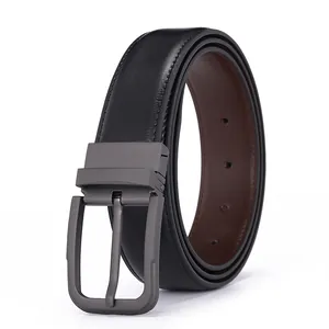 Detail of reversible black and brown leather belt with matte grey pin buckle