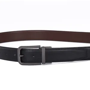 Detail of reversible black and brown leather belt with matte gunmetal swivel pin buckle