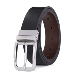 Macro detail of men's reversible leather belt with polished silver rotating buckle