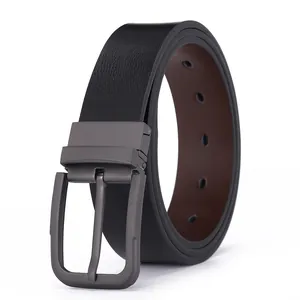 Detail of reversible leather belt showing black and brown sides with metal pin buckle