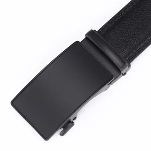Close-up of black matte metal automatic buckle and lychee grain leather men's belt