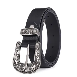 Close-up of vintage Western buckle with floral engravings on 2.8cm black leather belt