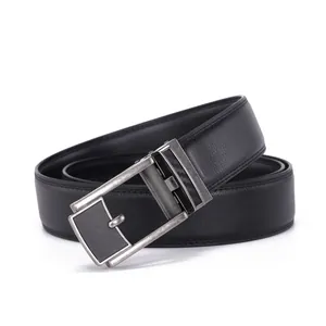 Detailed close-up of a men's black leather belt with fine stitching and a textured metal buckle