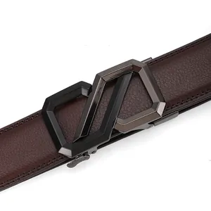 Detail of dark brown litchi grain leather belt and modern gunmetal geometric buckle