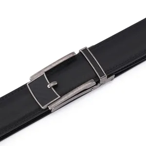 Close-up of men's leather belt with retro automatic buckle and carbon fiber details