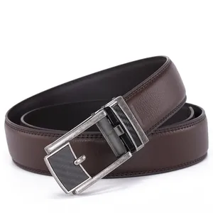 Detail of dark brown leather belt featuring litchi grain and brushed metal automatic buckle