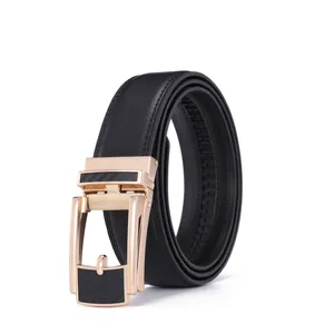 Macro view of men's leather belt featuring a carbon fiber pattern on the gold buckle