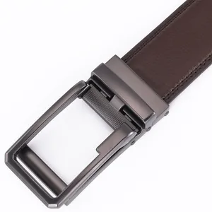 Macro shot of dark brown leather belt with high-quality stitching and metal buckle