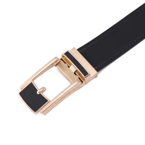 Detail of premium black leather belt showing golden automatic buckle and stitching