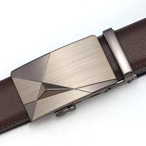 Macro detail of men's leather belt with brushed metal automatic buckle and litchi texture