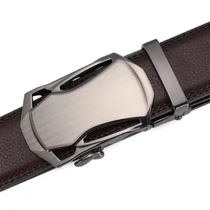 Macro view of brown lychee grain leather belt with brushed metal automatic buckle