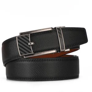 Detail of black leather ratchet belt with gunmetal carbon fiber buckle on white background